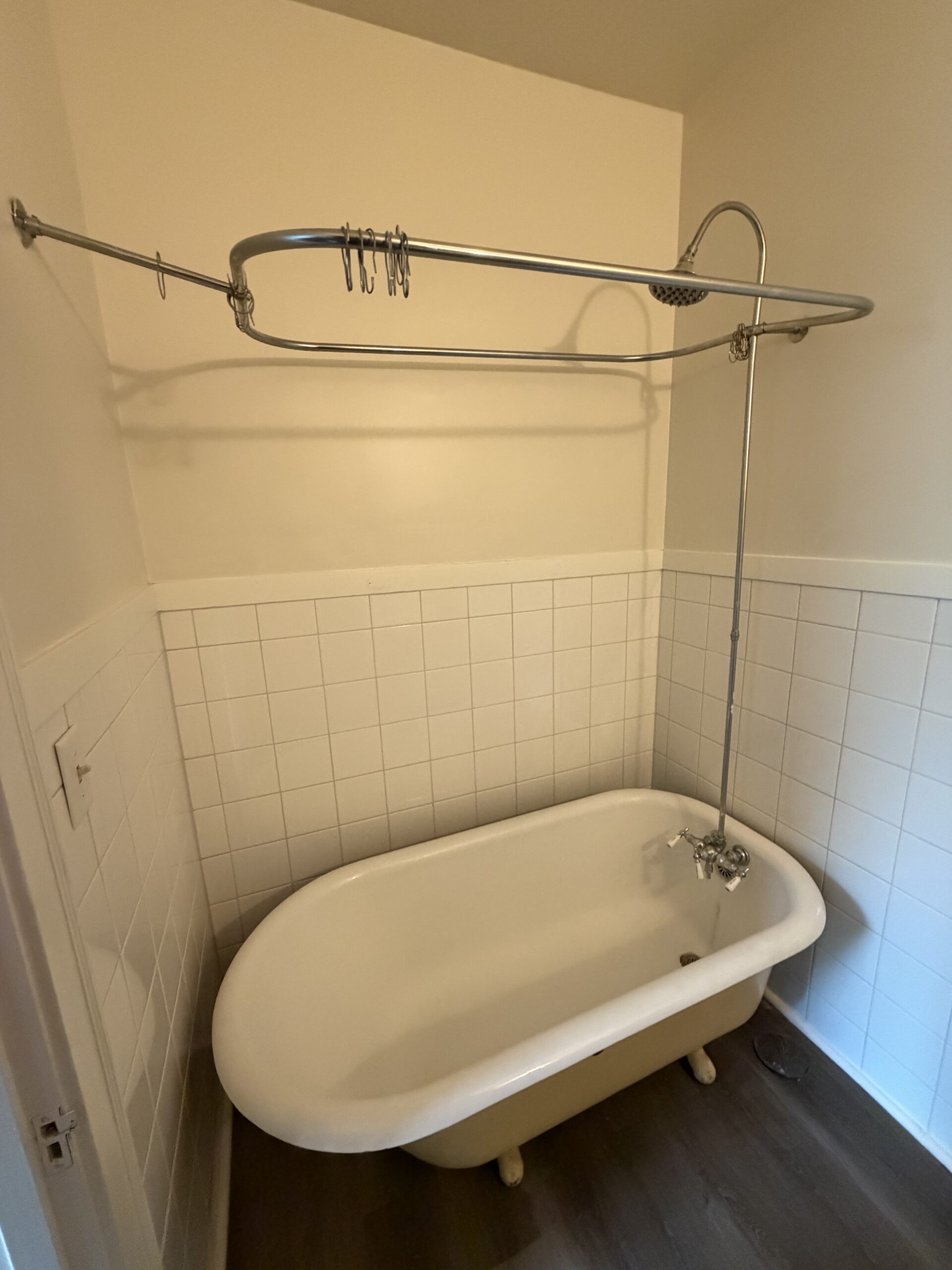 Freestanding Bathtub with Shower Unit 8 - Studio Apartment with Full-Size Stove Kitchen, Private Bath & Two Closets at Holub Apartments in Northside Iowa City, IA