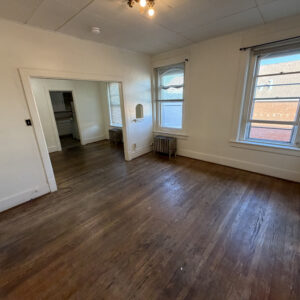 From the living room looking into the dining room and kitchen - 1 bathroom apartment in Northside Iowa City at Holub Apartments - Unit-2