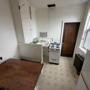 Kitchen in the Studio Apartment Unit 5 in Northside Iowa City, IA at Historic Holub Apartments