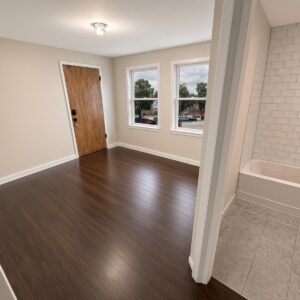 Unit-A - Livingroom and into bathroom at Holub Apartments in Iowa City, IA
