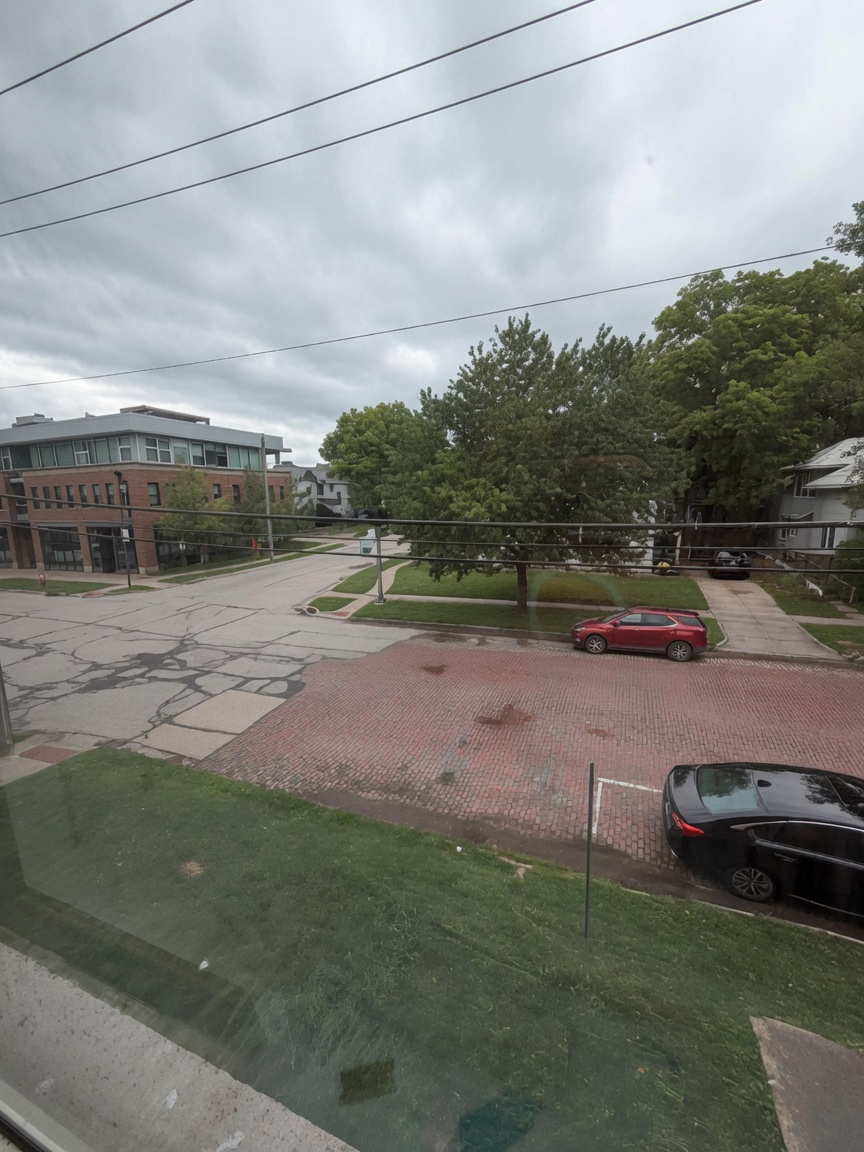 View out of the Kitchen Unit 8 - Studio Apartment with Full-Size Stove Kitchen, Private Bath & Two Closets at Holub Apartments in Northside Iowa City, IA