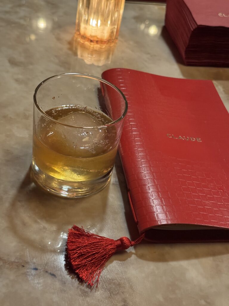 Drink and menu at Claude (French restaurant) at 215 N Linn St, Iowa City, IA 52245