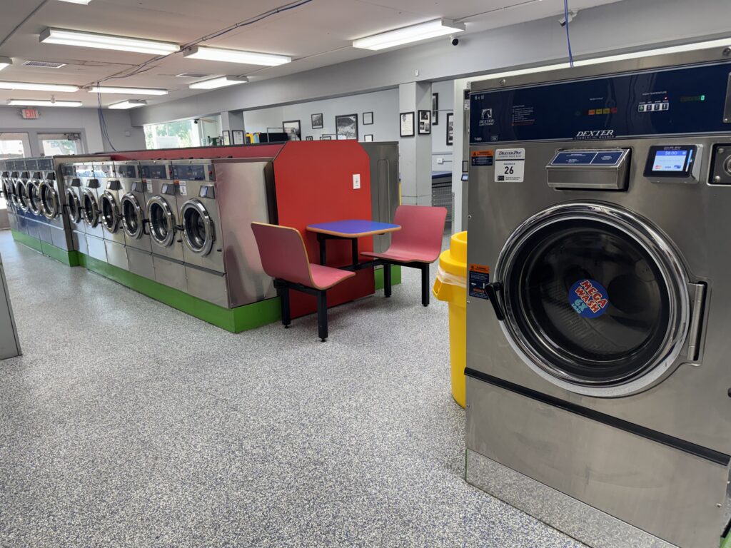 Multiple washing machines at Laundromania in Iowa City next to Holub